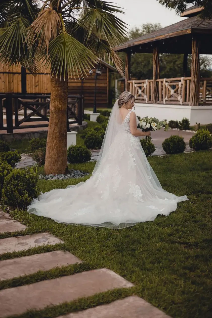 Model wearing a white gown on the grass