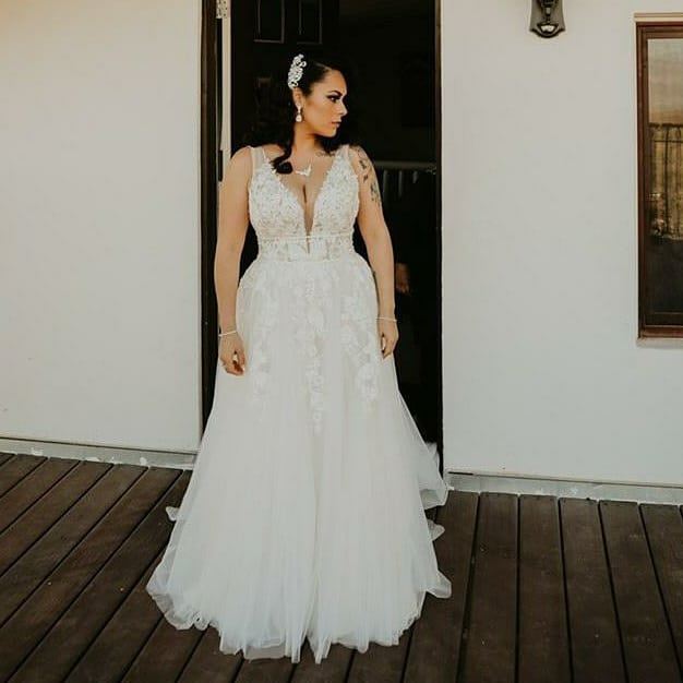 Model wearing a bridal gown at home